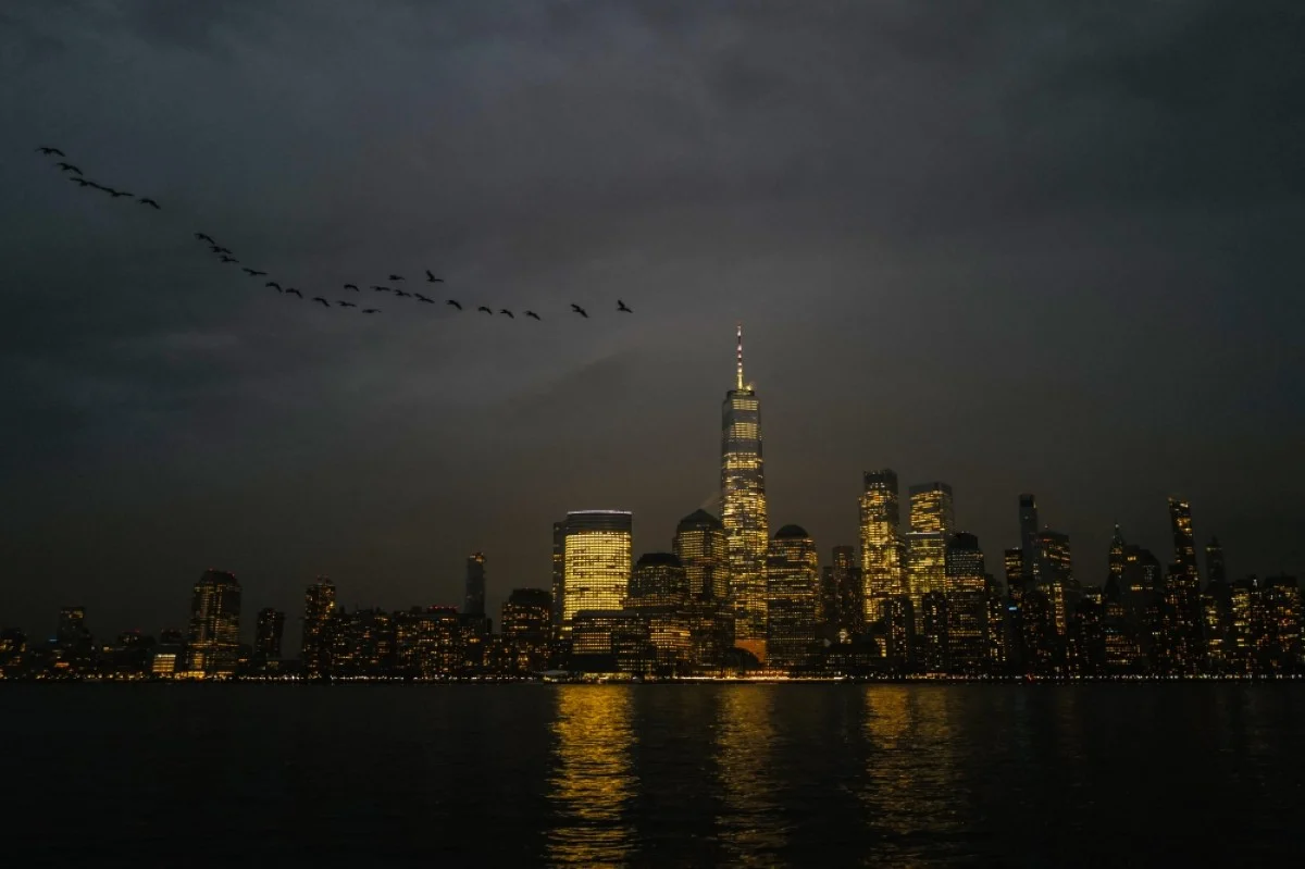 JERSEY CITY: Night view of New York city’s lower Manhattan skyline, with the One World Trade Center skyscraper, as seen from Jersey City.- AFP