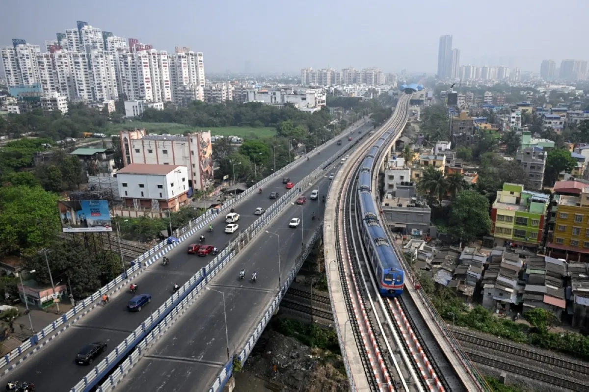 KOLKATA: A metro train runs over a newly launched stretch between New Garia and Ruby stations, after commencement of its commercial services in Kolkata. – AFP