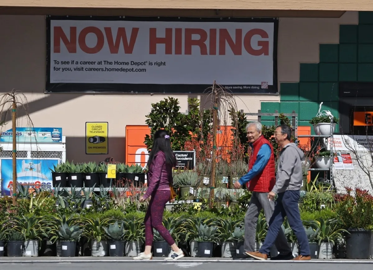 CALIFORNIA: Home Depot customers walk by a posted now hiring sign in San Rafael, California. – AFP