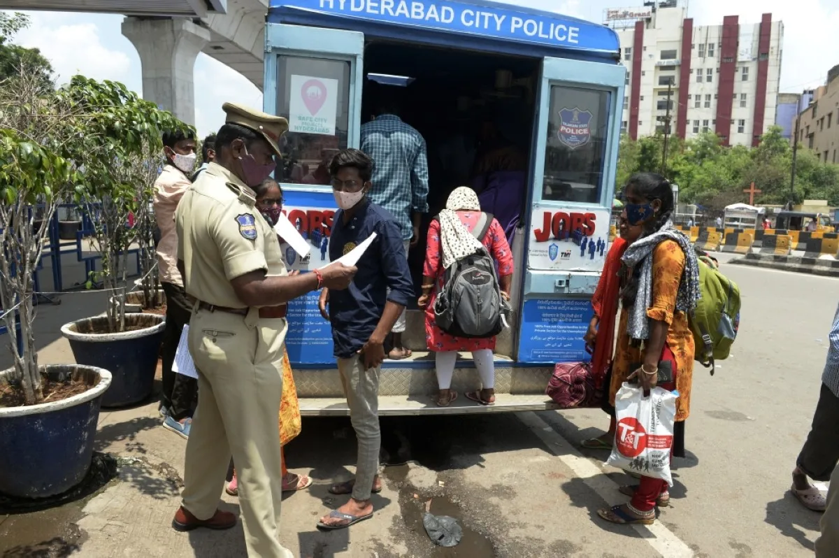 HYDERABAD: Unemployed people gather by an ‘employment van’ to fill application forms and access job openings in the private sector in this file photo. – AFP