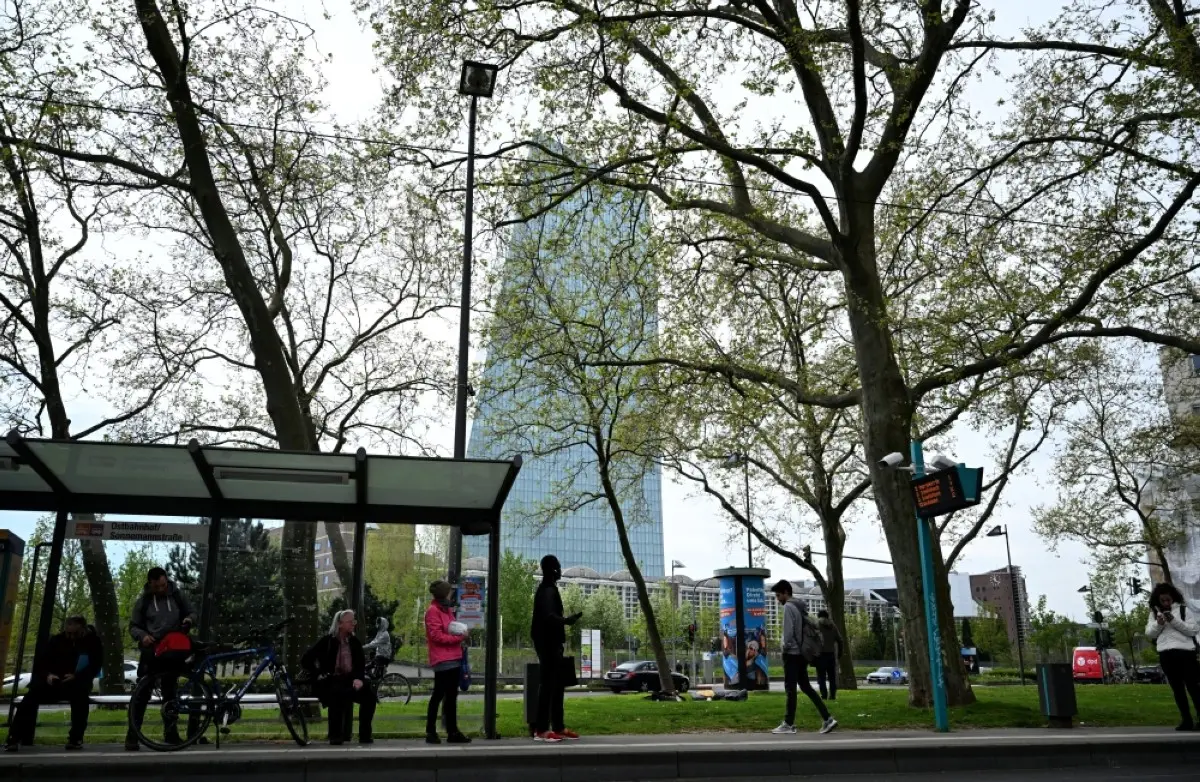 FRANKFURT: People wait at a bus stop close to the headquarters of the European Central Bank (ECB) in Frankfurt am Main, western Germany.- AFP
