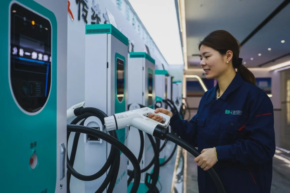 RUICHANG: An employee works at a factory that produces charging stations for electric cars in Ruichang, in central China’s Jiangxi province on April 17, 2024. – AFP