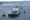 SYDNEY:  Tugboats escort a crude oil tanker, Kara Sea, through Sydney Harbor.- AFP