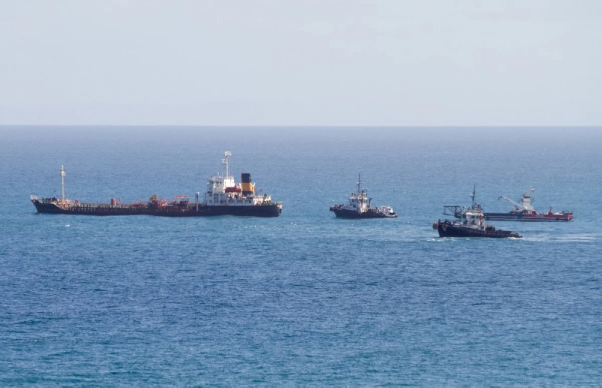 PAMPATAR: Tugboats mobilize the Crude Oil Tanker President, anchored in Pampatar Bay two years ago in Margarita Island, Nueva Esparta state, Venezuela.- AFP