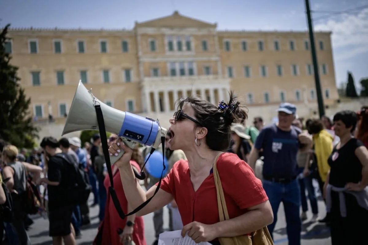 ATHENS: A woman takes part in a demonstration in central Athens, after labor unions in Greece called a 24-hour nationwide strike to protest against the rise of the cost of living. - AFP