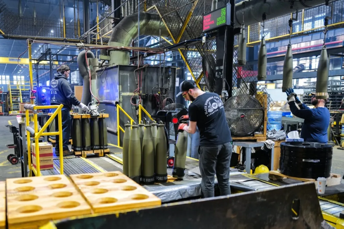 SCRANTON: Workers handle 155 mm caliber shells post-manufacturing, preparing them for shipment at the packaging area of the Scranton Army Ammunition Plant (SCAAP) in Scranton, Pennsylvania.- AFP photos