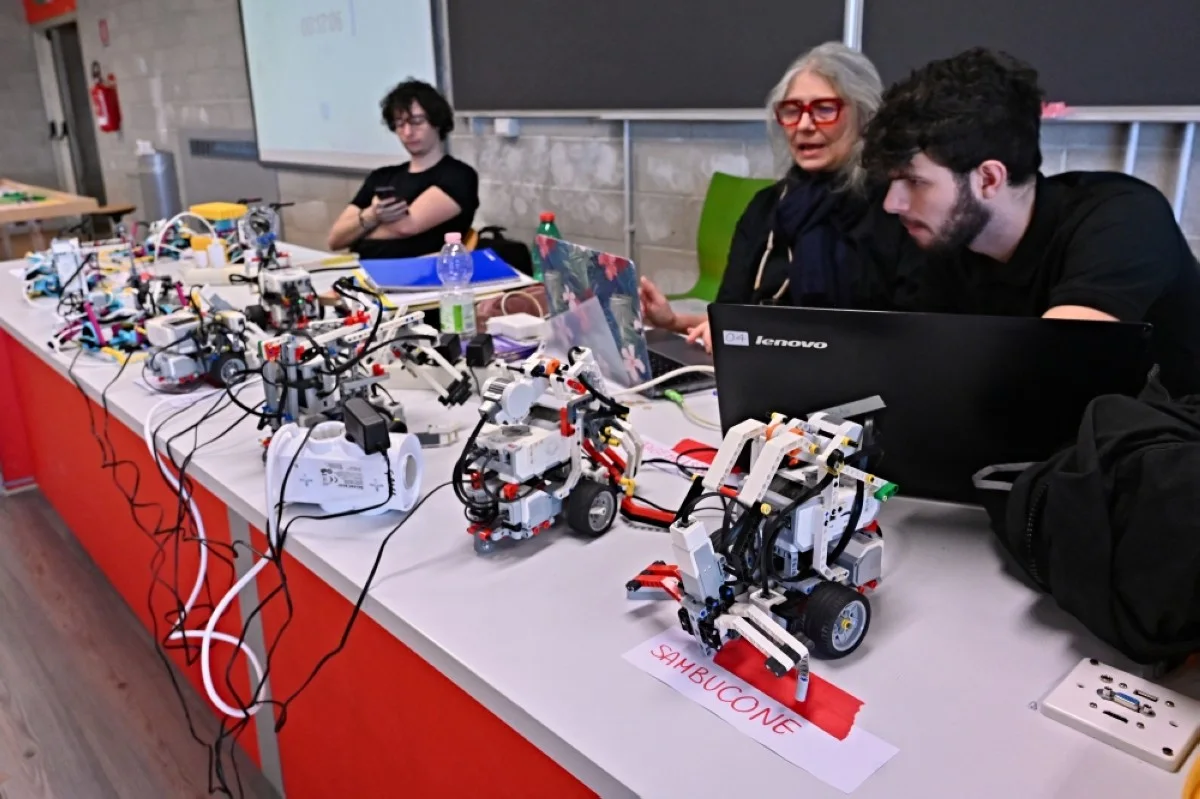 ROME: A professor (center) along with students test mechanical robots during the RomeCup 2024 focusing on ‘Artificial Intelligence and Robotics for the challenge of holistic sustainability’, an event dedicated to the frontiers of technological development, at the University of Tor Vergata, in Rome.- AFP