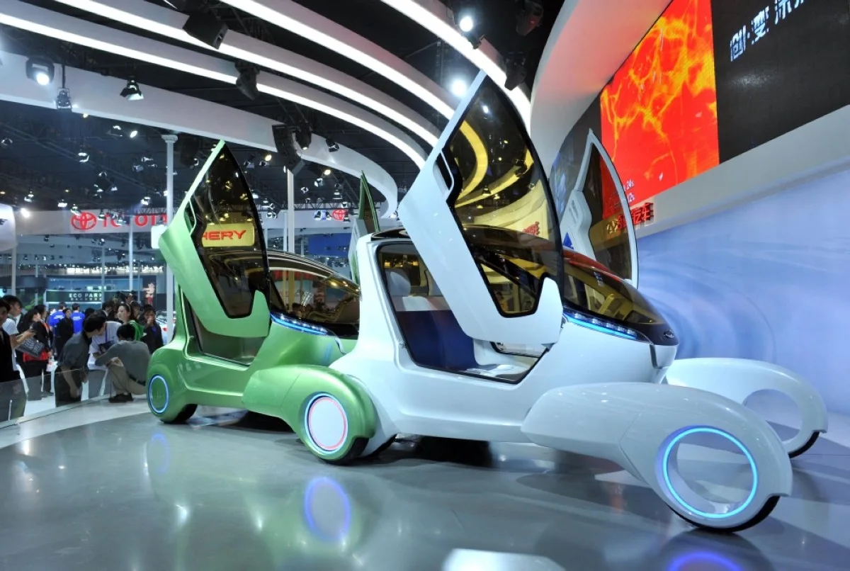 BEIJING: Guests check out the concept cars from Chinese carmaker Chery on display at the Auto China 2012 exhibition in Beijing.- AFP