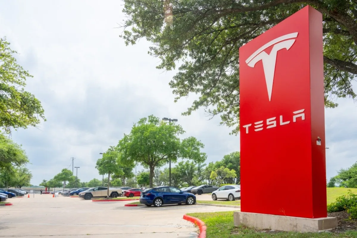 AUSTIN: The Tesla logo is displayed at a Tesla dealership in Austin, Texas. - AFP