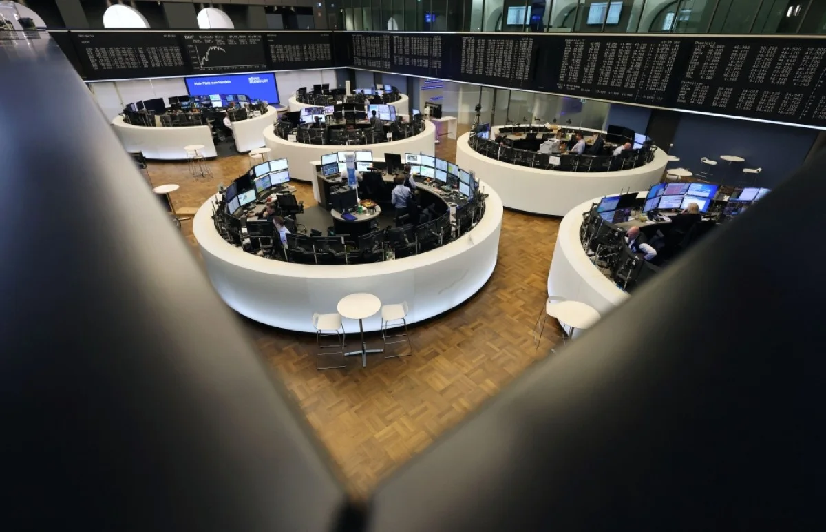 FRANKFURT: Brokers are pictured at the stock exchange in Frankfurt, western Germany.- AFP