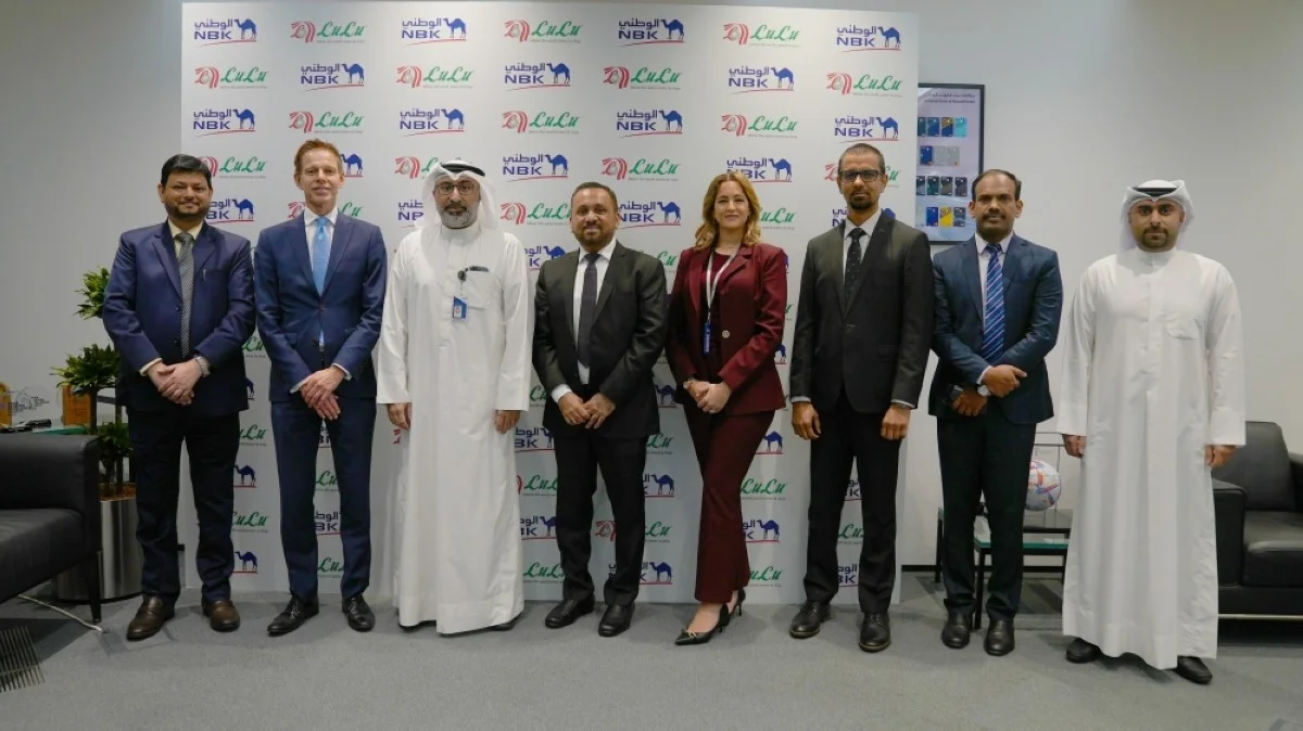 NBK and Lulu Hypermarket teams pose for a group photo.