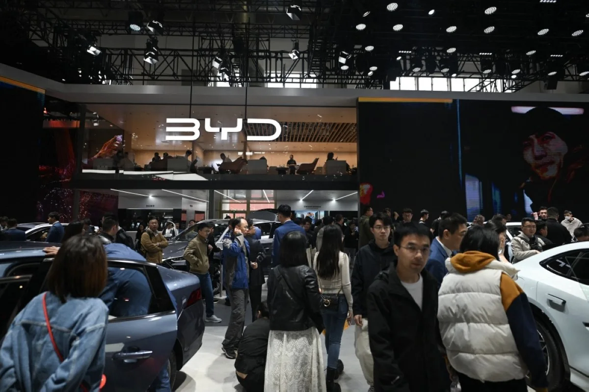 BEIJING, China: People visiting the BYD stand at the Beijing Auto Show in Beijing. -- AFP