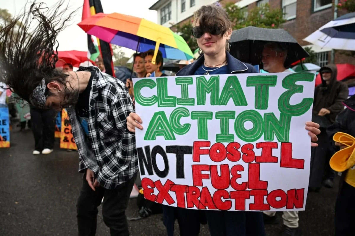 SYDNEY: Environmental activists hold a protest rally in front of Kirribilli House, the official residence of the Australian Prime Minister, in Sydney on May 8, 2024, calling for the Albanese government to halt further approvals of coal and gas projects. – AFP