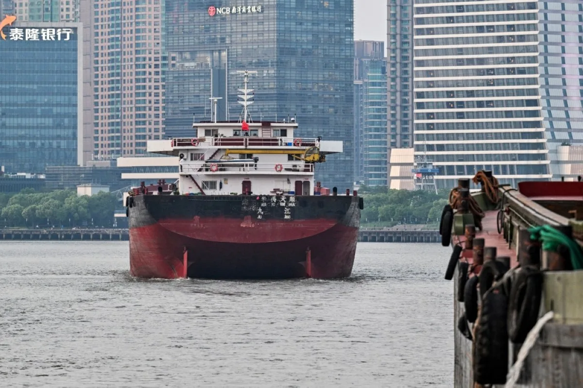SHANGHAI: Ships sail across the Huangpu river in Shanghai.- AFP