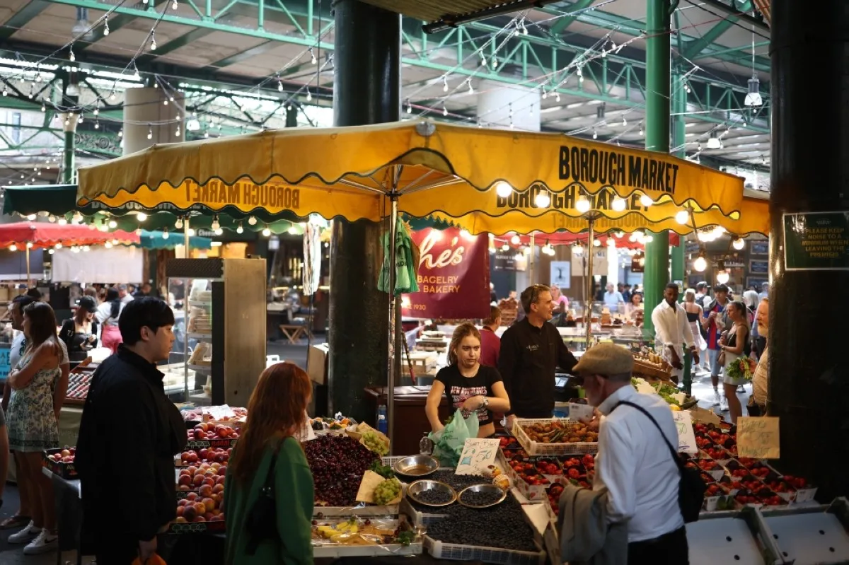 LONDON: People shop for fruit and vegetables at Borough Market in London on May 10, 2024. -- AFP