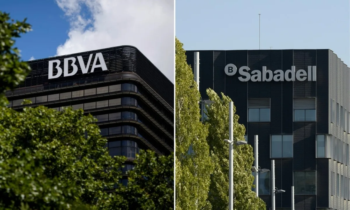 MADRID, Spain: This combination of file pictures shows the logo of Spanish bank BBVA in a building in Madrid (left) and the logo of Sabadell Bank in a building in Sant Cugat de Valles. -- AFP