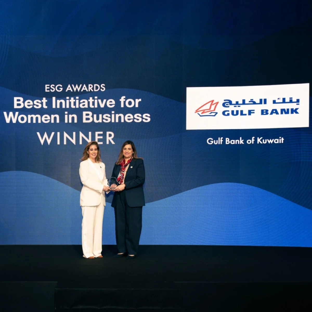 Salma Al-Hajjaj and Najla Al-Eisa receive awards from MEED magazine.