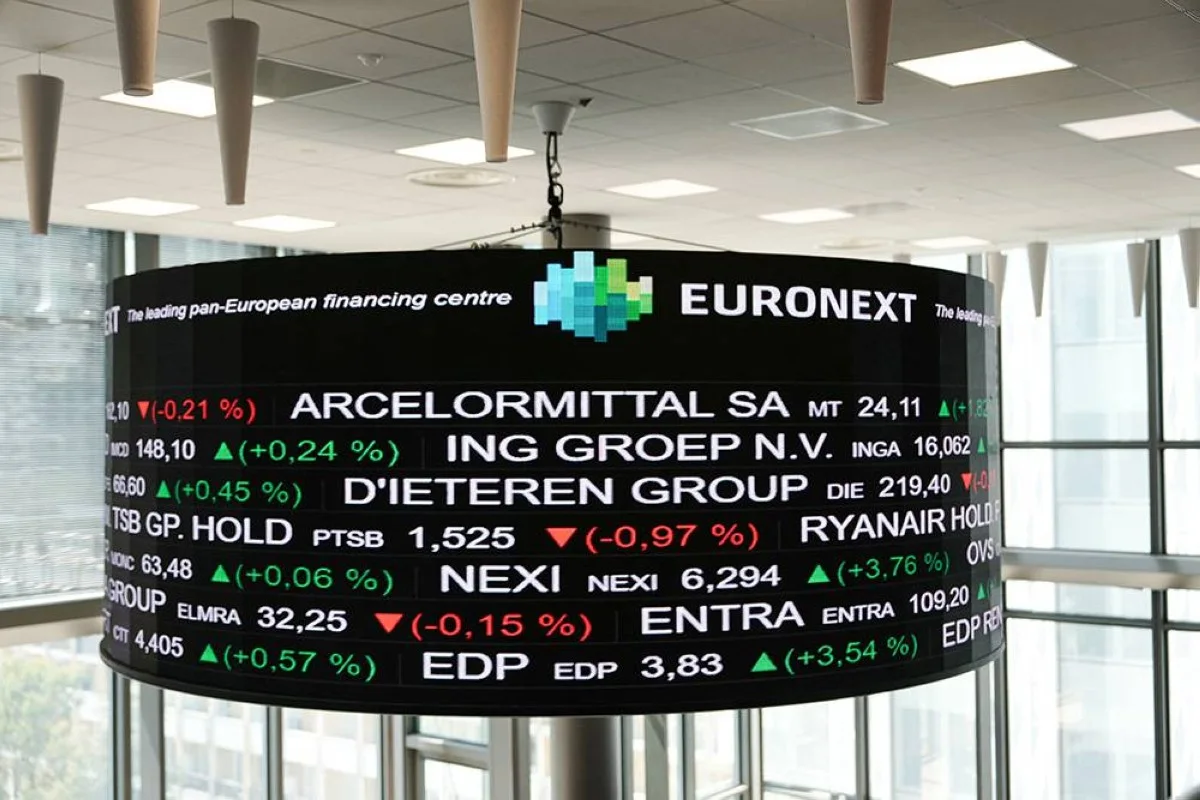 This photograph shows the Euronext's stock price indicator display at Euronext building in La Defense, on the outskirts of Paris, on May 10, 2024. - European stock markets climbed to fresh record highs on M ay 10, 2024 on growing hopes that central banks are close to cutting interest rates. — AFP