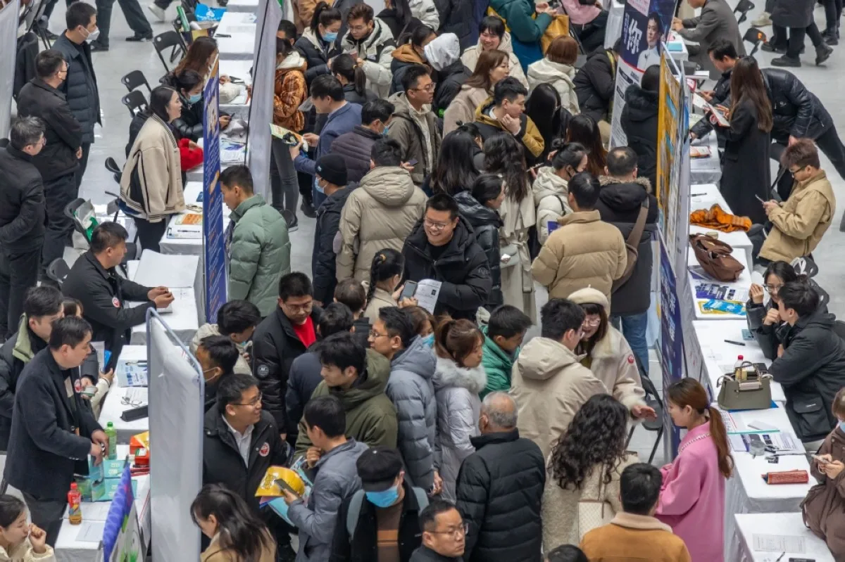 ZHENGZHOU, China: People attend a job fair in Zhengzhou, in central China's Henan province. – AFP