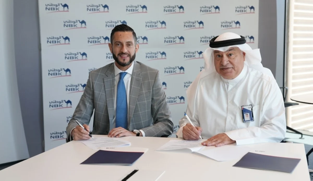Fahad Al-Thuwaini and Makram Raad during the signing ceremony.
