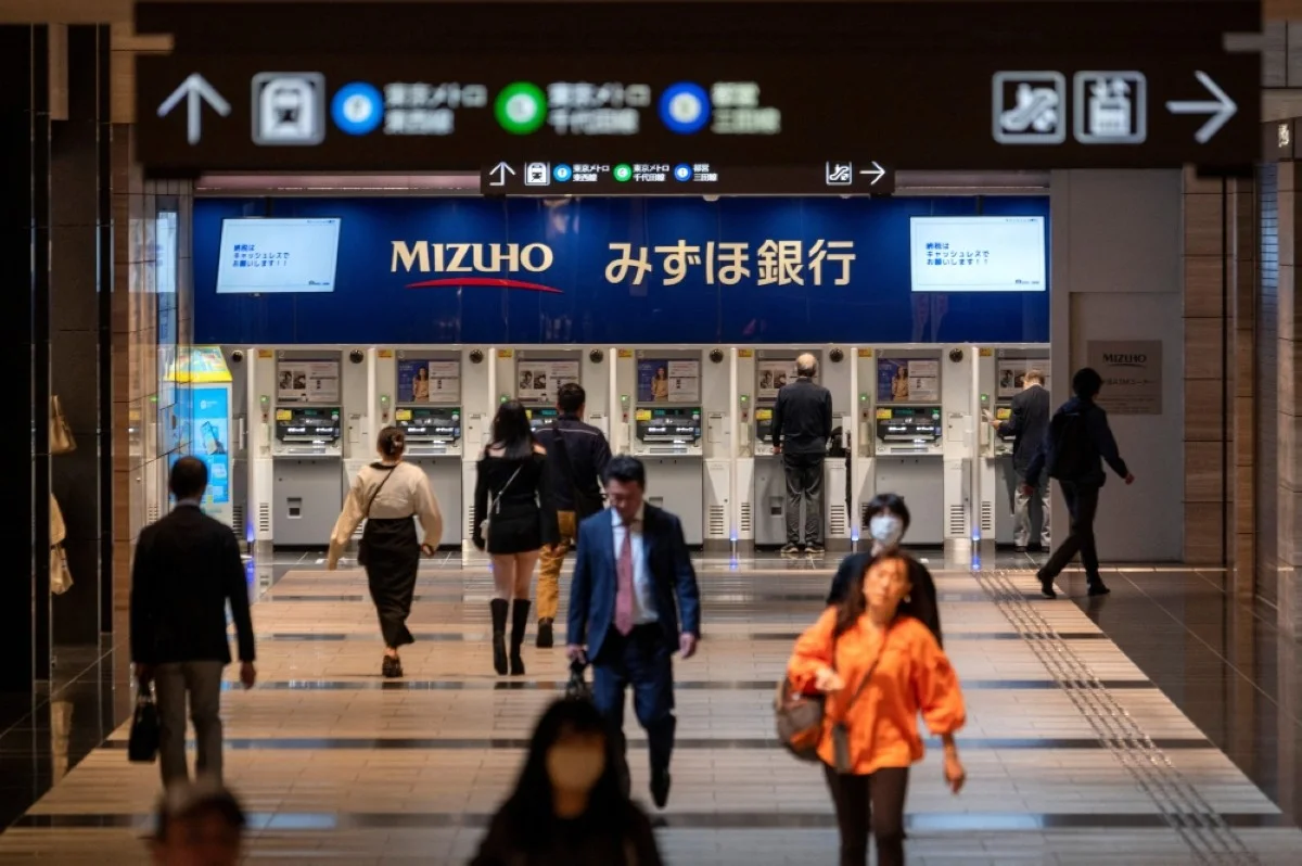 TOKYO: People walk along an underground concourse leading to the subway in Tokyo on May 16, 2024. Japan's economy suffered a worse-than-expected contraction in the first quarter, official data showed May 16, in further bad news for its unpopular government.-- AFP