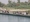 عراقيون يسيرون على جسر بين شرق الموصل وغربها أمس الأول (روتيرز)