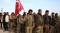 






عناصر ترفع العلم التركي في ليبيا                                     (مكة)