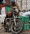 يمني يحمل سلته الغذائية على دراجة نارية (واس)