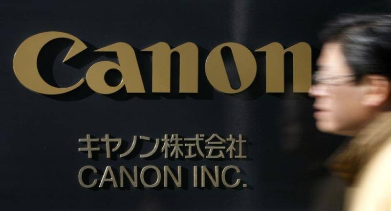 A man walks past a Canon Inc sign at the company’s headquarters in Tokyo in this file picture taken on January 14, 2009. — Reuters pic