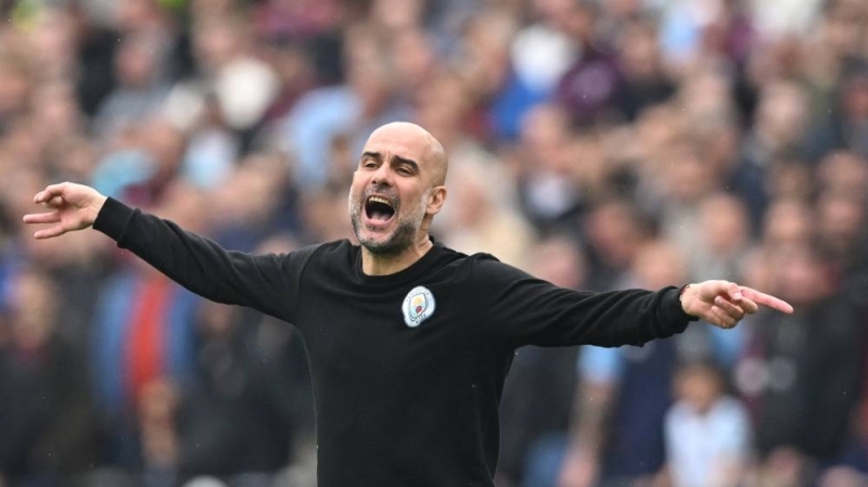 Manchester City manager Pep Guardiola reacts during the English Premier League match between West Ham United and Manchester City at the London Stadium, in London May 15, 2022. — AFP pic 