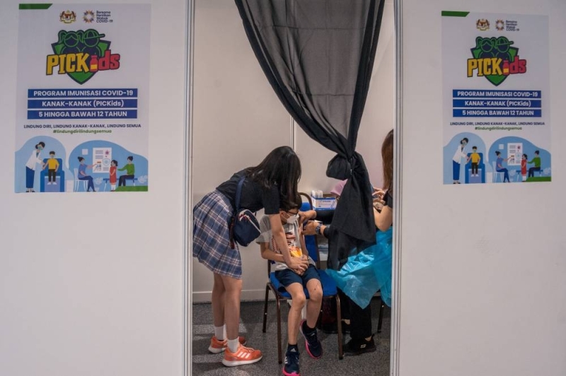 Children aged between five and 12 years old get their Covid-19 vaccine during the National Covid-19 Immunisation Programme for Kids (PICKids) at Axiata Arena in Bukit Jalil February  3, 2022. -  Picture by Shafwan Zaidon