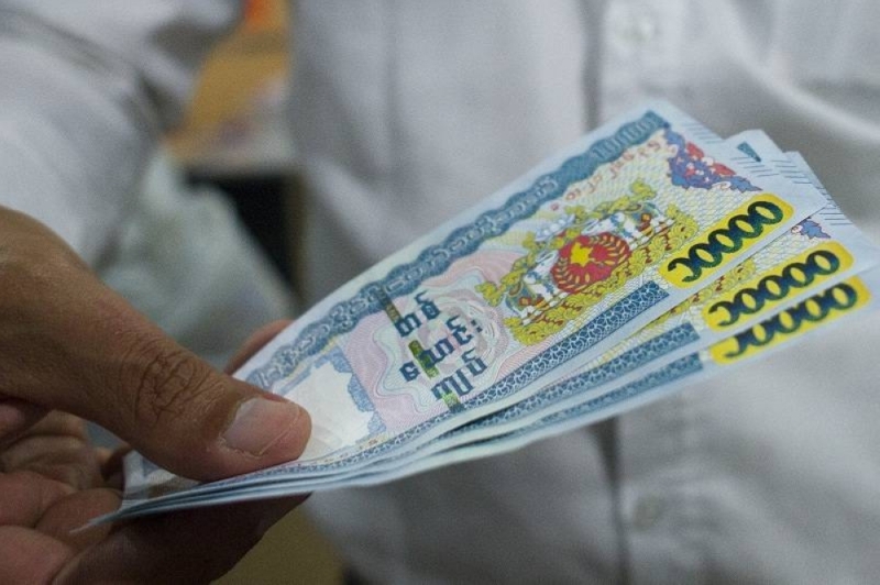 Myanmar’s economy has been in crisis since the military seized power last year, halting a decade of political and economic reforms and piling pressure on the kyat's exchange rate against the US dollar. ― AFP pic