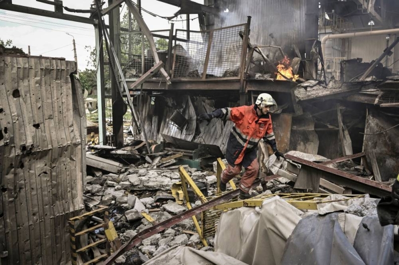 A fireman participates in extinguishing a fire at a Gypsum Manufactory plant after shelling in the city of Bakhmut at the eastern Ukrainian region of Donbas on May 27, 2022, on the 93rd day of the Russian invasion of Ukraine. —