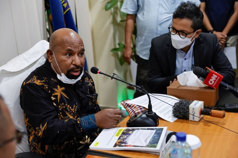Papua Governor Lukas Enembe speaks next to the Executive Director of Amnesty International Indonesia Usman Hamid during a meeting in Jakarta, Indonesia, May 27, 2022. — Reuters pic