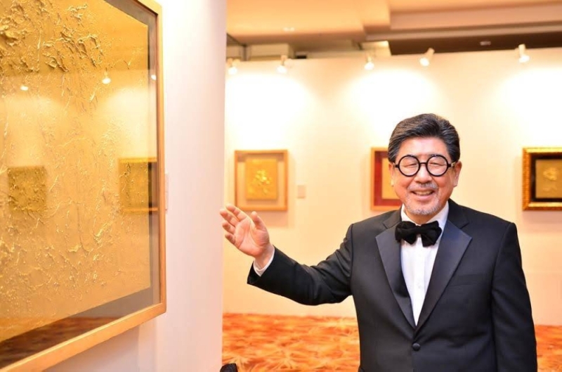 Kim with some of his gold paintings that were recently featured in an exclusive exhibition in KL. — Picture via Aureo Gallery.