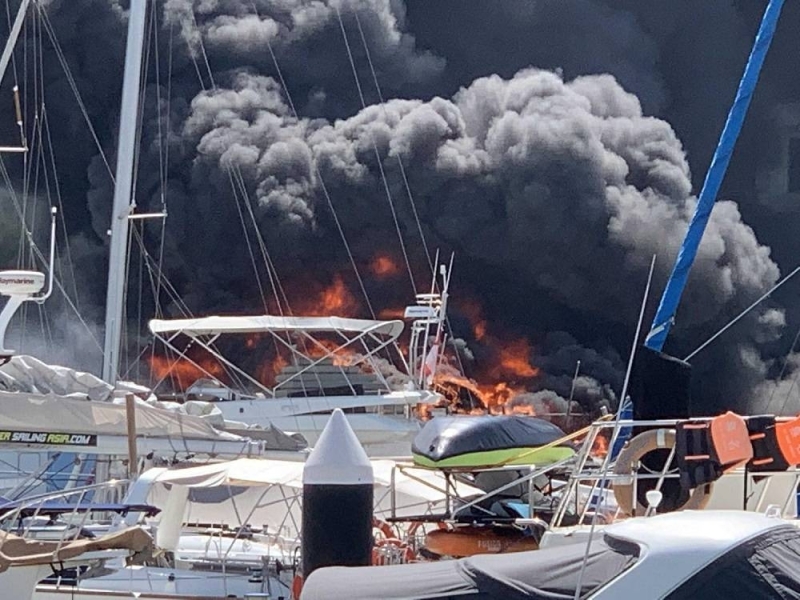 A fire broke out on a boat at Marina at Keppel Bay. — Picture via TODAY