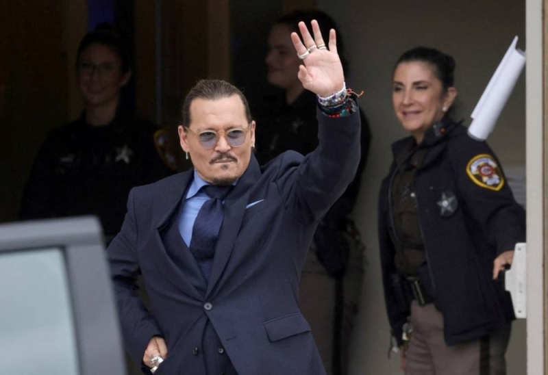 Actor Johnny Depp gestures as he leaves the Fairfax County Circuit Courthouse following his defamation trial against his ex-wife Amber Heard, in Fairfax May 27, 2022. — Reuters pic