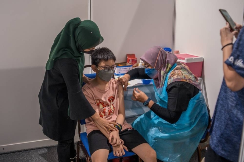 Children aged between five and 12 get their Covid-19 vaccine at the Axiata Arena in Bukit Jalil February 3, 2022. — Picture by Shafwan Zaidon