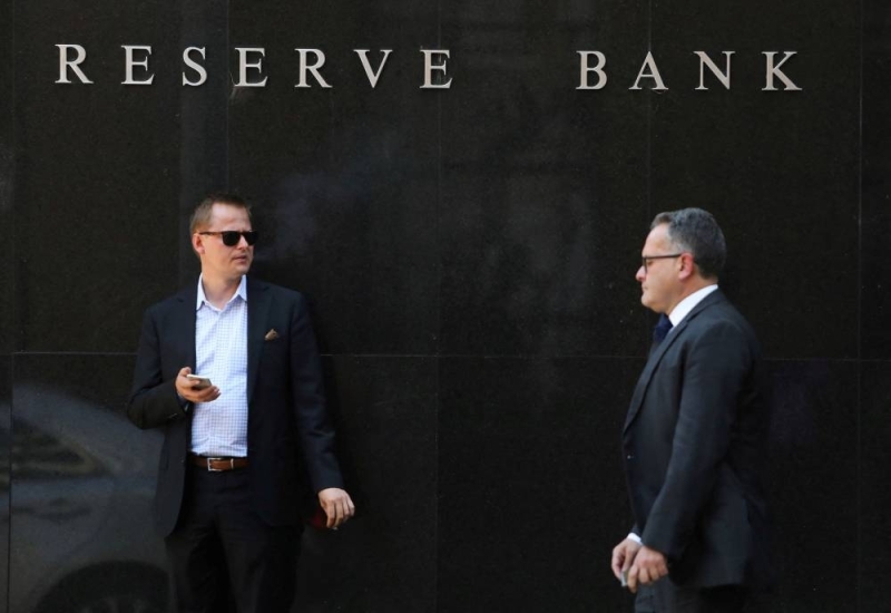  A man smokes next to the Reserve Bank of Australia headquarters in central Sydney February 6, 2018. — Reuters pic