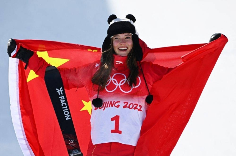 Gold medallist Eileen Gu of China poses for pictures on the podium after winning the women’s freeski halfpipe event at the Beijing Winter Olympics February 18, 2022. — Reuters pic