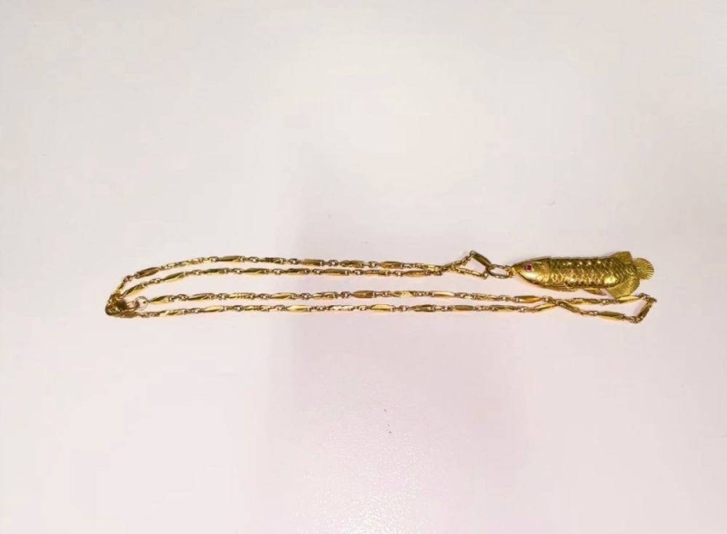 A gold necklace that three youths attempted to steal from a 16-year-old at Central Mall on June 6, 2022. — Picture courtesy of Singapore Police Force
