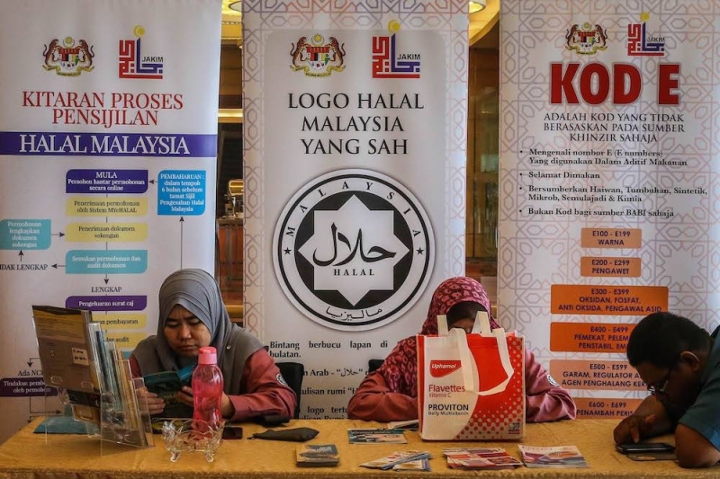 File picture of the halal logo on a banner during a Jakim event. — Picture by Firdaus Latif
