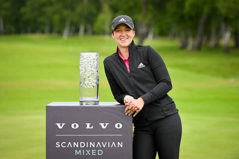 Sweden's Linn Grant poses with the trophy after winning the Scandinavian Mixed annual golf tournament on the European Tour at Halmstad Golf Club, Sweden on June 12, 2022. — Pontus LUNDAHL / TT News Agency / AFP pic