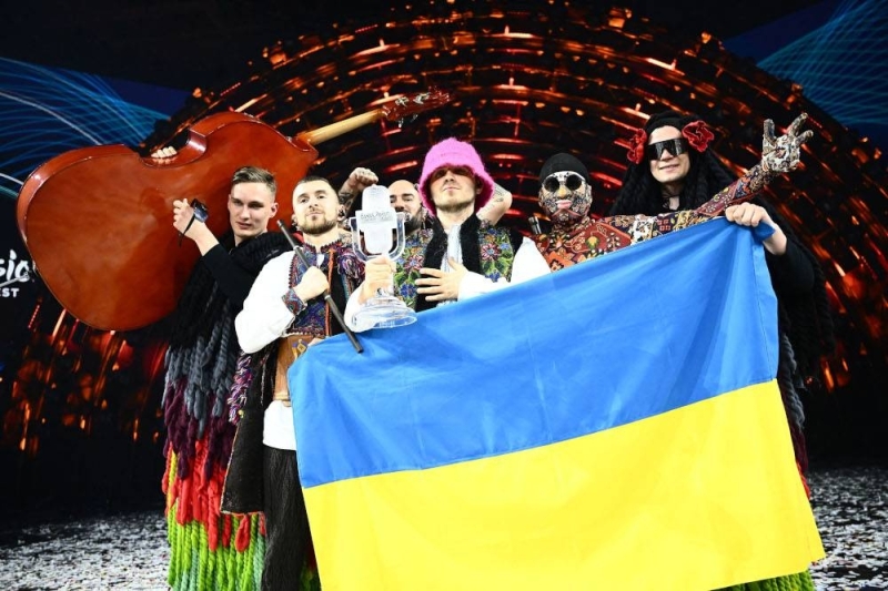 Members of the band Kalush Orchestra pose onstage with the winner’s trophy and Ukraine’s flags after winning the Eurovision Song contest 2022 on behalf of Ukraine. — AFP pic 