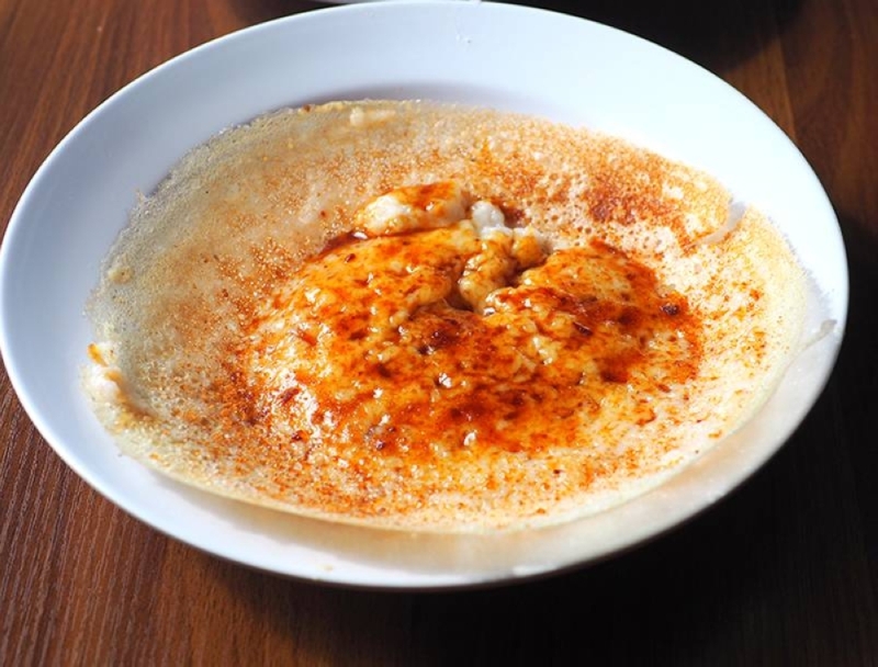 'Appam' with brown sugar and coconut milk for a lovely crispy crust and soft centre sprinkled with fresh coconut milk and brown sugar. — Pictures by Lee Khang Yi