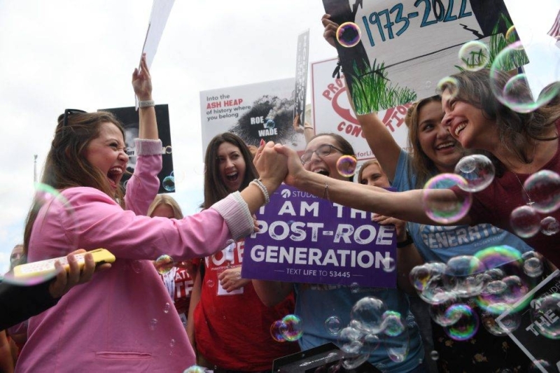 Anti-abortion campaigners celebrate outside the US Supreme Court in Washington, DC, on June 24, 2022. — AFP via Getty Images