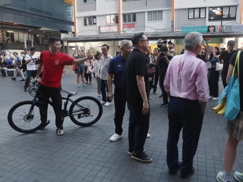 Cyclist who heckled Singapore presidential candidate Ng Kok Song in Clementi arrested under Mental Health Act, taken to IMH