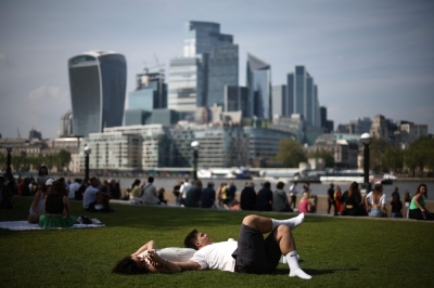 Hotter, drier, sicker? How a changing planet drives disease A couple rest on the grass near the banks of the River Thames, backdropped by the financial district in London, on May 10, 2024. — ETX-Relaxnews pic
