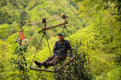 Deathtrap cable cars spook Turkiye's intrepid tea farmers Mehmet Sen rides the primitive cable car in the village of Daginiksu, in the north-eastern Turkiye province of Rize. ― AFP pic