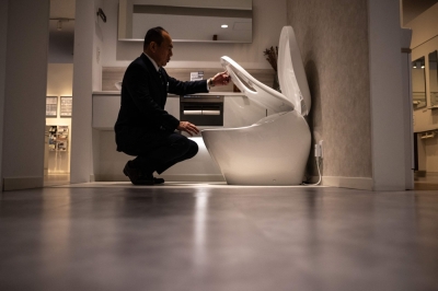 Feeling flush: Japan’s high-tech toilets go global In this picture taken on February 15, 2024, museum director Junichi Koga presents the washlet functions of one of the toilets at the museum of Japanese toilet manufacturer TOTO, in the city of Kitakyushu, Fukuoka Prefecture. — AFP pic